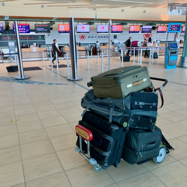 Piled suitcases at airport